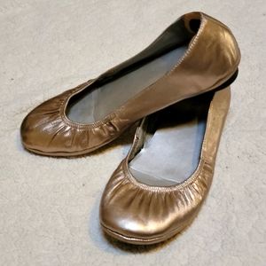 Pewter rose gold leather ballet flats with a half inch grippy sole. Comfortable!